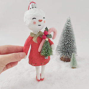 Spun cotton vintage inspired snow lady ornament, held up by hand for size comparison. Pic 7 of 7.