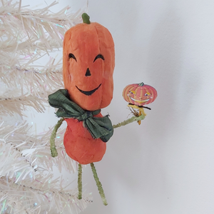 Spun cotton vintage style pumpkin man ornament hanging on white tree. Pic 3 of 8.. 