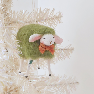 Spun cotton green sheep ornament, hanging on white tree. Pic 3 of 6. 