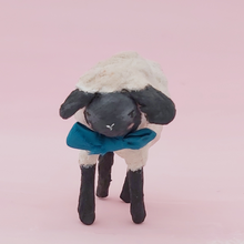 Cargar imagen en el visor de la galería, A close up of the front of a miniature spun cotton sheep against a pink background. Pic 3 of 8. 
