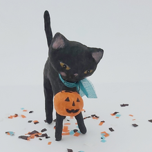 Load image into Gallery viewer, A vintage style spun cotton black cat standing on Halloween confetti against a white background. Pic 1 of 6. 
