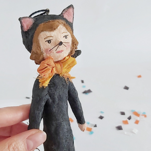 Vintage style spun cotton cat girl standing on Halloween confetti against a white background. Pic 1 of 8. 
