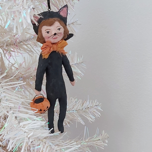 A vintage style spun cotton cat girl ornament hanging on a tree. Pic 2 of 8. 