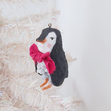 Cargar imagen en el visor de la galería, A side frontal view of spun cotton pine cone penguin hanging on white Christmas tree. Pic 4 of 10. 
