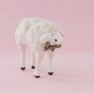 Another side front view of spun cotton sheep against a pink background. Pic 6 of 8.