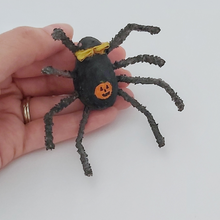 Load image into Gallery viewer, Hand holding spun cotton spider and showing painted jack-o-lantern on his stomach. Pic 4 of 6. 
